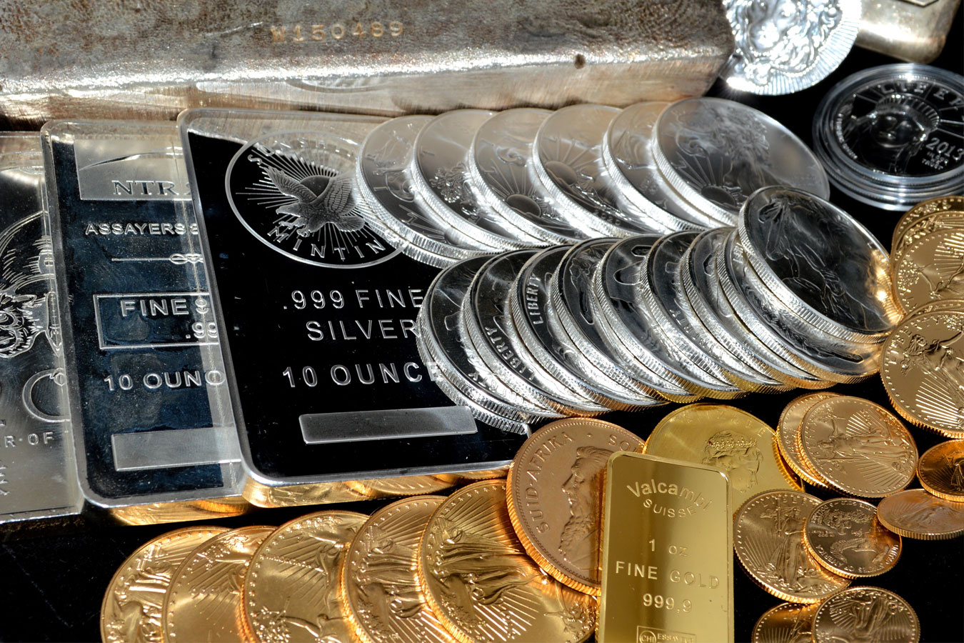 silver bars and coins and gold coins